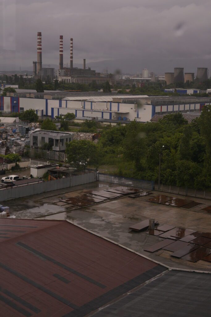 Rainy industrial yard and power plant