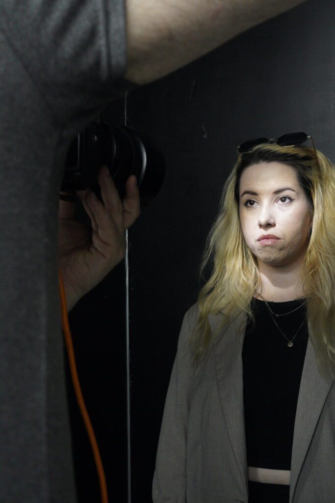 Close portrait session against black backdrop