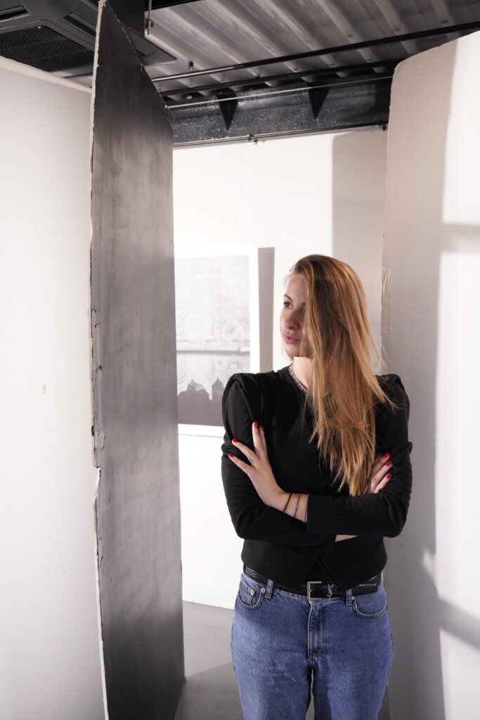 Portrait between studio wall panels