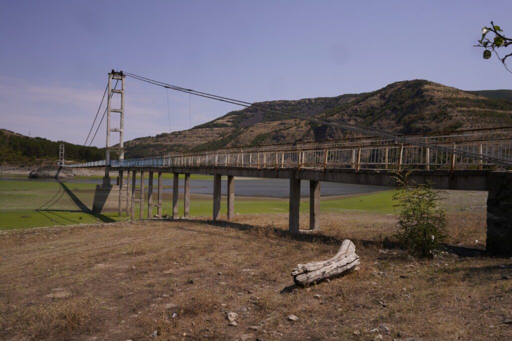 Suspension bridge over dry reservoir bed
