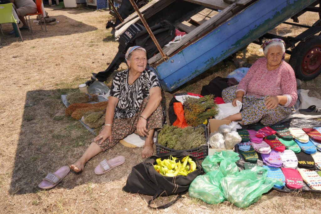 Village women selling herbs and socks