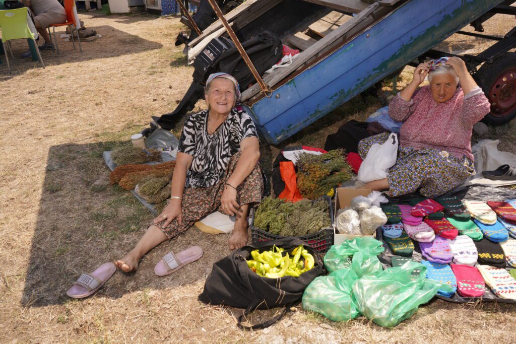 Market sellers smiling in the shade