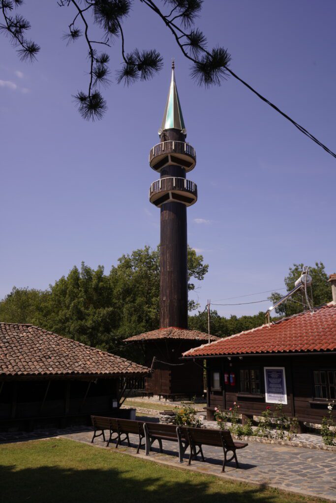 Wooden minaret in the village courtyard
