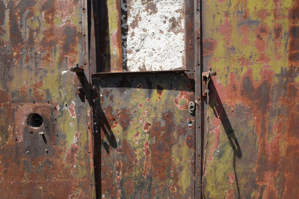 Rusted green metal door