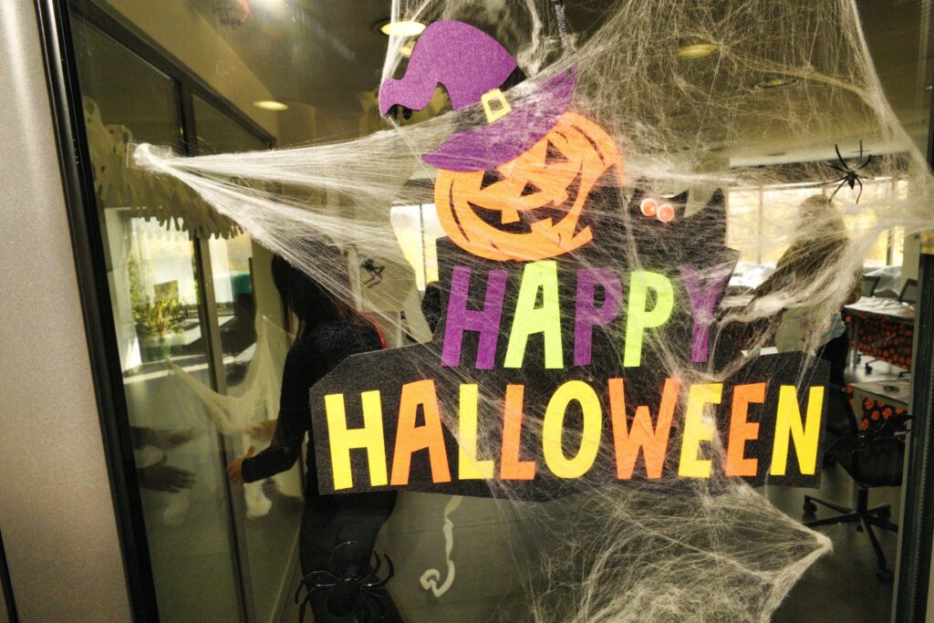 Happy Halloween sign on office glass