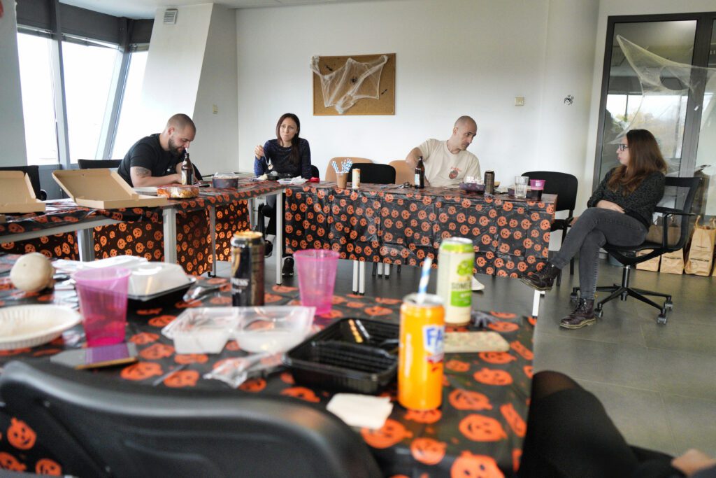 Colleagues lunching at Halloween tables