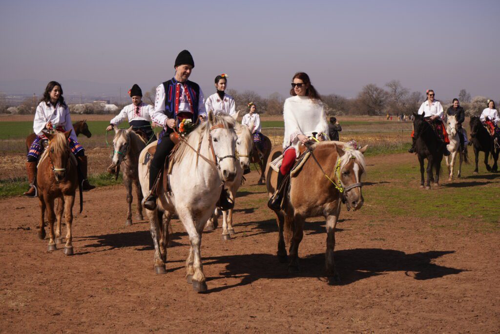 Riders in folk dress on horseback