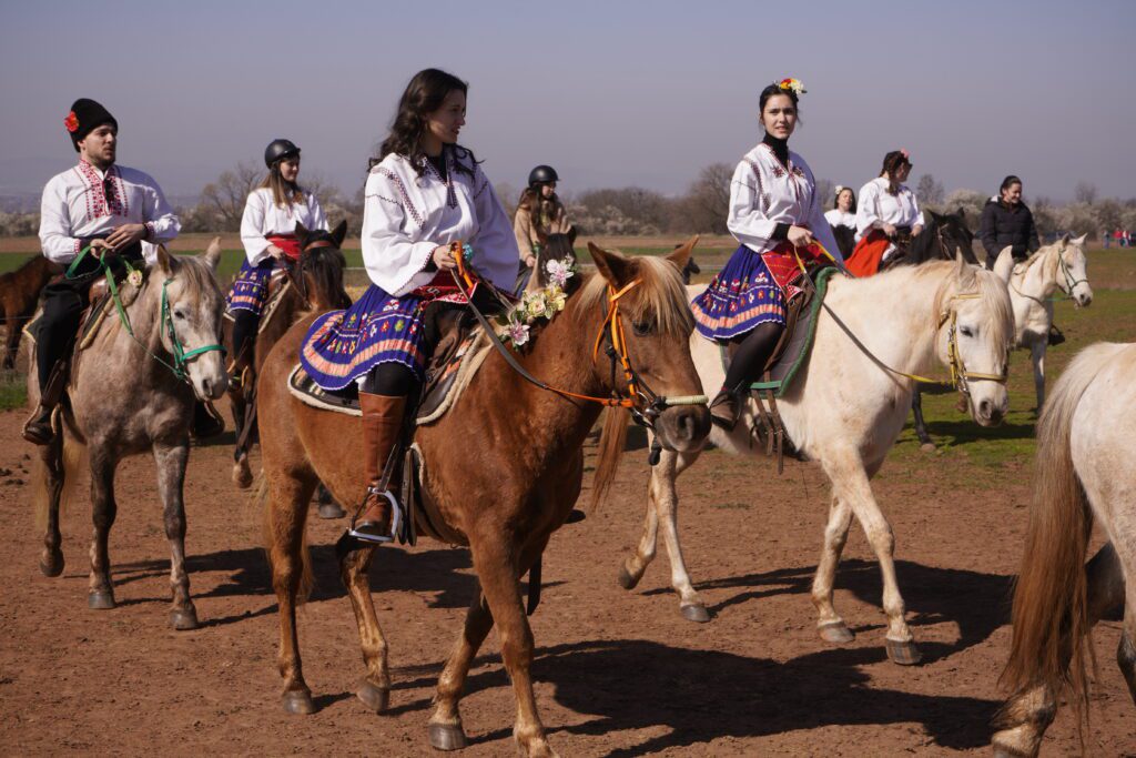 Young riders in traditional costumes
