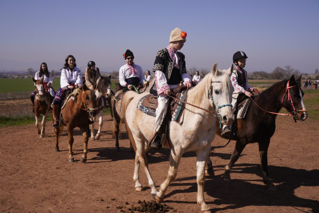 Procession of riders in folk dress
