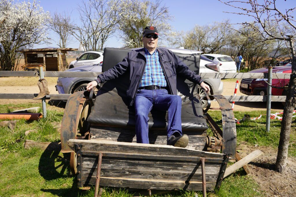 Visitor resting in wooden carriage