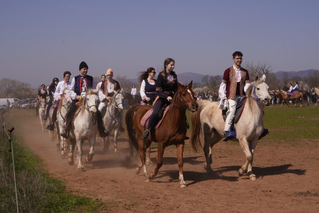 Folk-costumed riders in procession