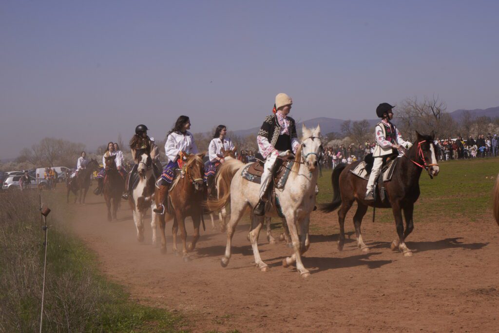 Horse riders approach along the track