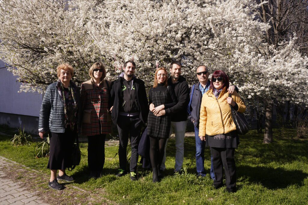 Group portrait under a blossoming tree