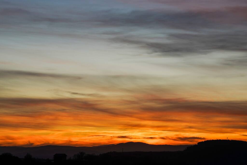 Sunset over silhouetted hills near Stakyov Kamik