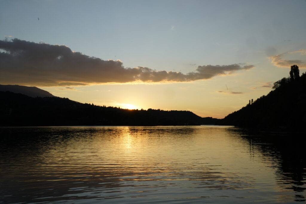 Sun Behind the Forested Ridge